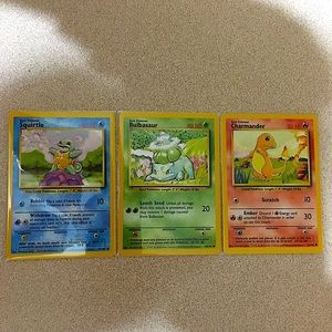 Pokémon Cards BASE SET CHARMANDER BULBASAUR AND SQUIRTLE RARE AND MINT CONDITION